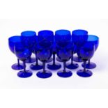 A set of thirteen blue glass wine goblets 8.5cm diameter x 16cm highCondition report: In good