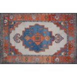 A Turkish red, blue and cream ground woollen carpet, 260cm x 363cmCondition report: Some minimal
