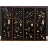 A set of four decorative Chinese black lacquered panels with hardstone inlay, in the form of vases