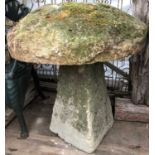 A carved staddle stone with a large top, 78cm diameter x 81cm highCondition report: Losses to the