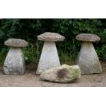 A group of three carved staddle stones with circular tops approximately 48cm diameter x 76cm high