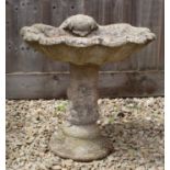 A shell moulded cast reconstituted stone bird bath approximately 48cm diameter x 53cm high Condition