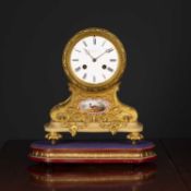 A good sized 19th century French ormolu and marble cased mantle clock the fluted drum movement on