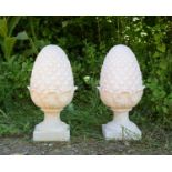 A pair of cast composite white painted pine cone finials, 52cm highCondition report: In good