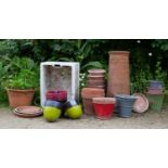 A Victorian terracotta chimney pot 78cm high together with an old Belfast sink and various garden