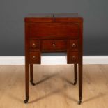 A George III mahogany wash stand with fold over top revealing recesses within, five various