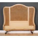 A cream painted caned curving double bed headboard 156cm wide x 45cm highCondition report: wear to