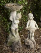 A reconstituted stone bird bath in the form of a boy supporting the bowl, 72cm high together with