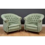 A pair of green upholstered tub chairs with button backs and short turned front legs terminating