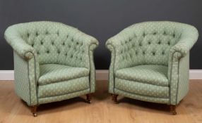 A pair of green upholstered tub chairs with button backs and short turned front legs terminating