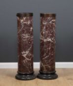 A pair of Scagliola marble columna sculpture plinths or torchieres with turned black painted bases