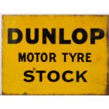 An early to mid 20th century yellow enamel double sided 'Dunlop Motor Tyre Stock' sign 61cm wide x