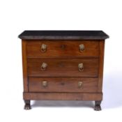 A 19th Century French mahogany and marble topped commode, the three drawers each with lion mask