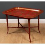 A chinoiserie style tray top table with Oriental decoration to the tray and ring turned legs to