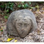 An ancient Celtic stone head, carved in Yorkshire gritstone, pre-medieval, 30cm x 30cm x