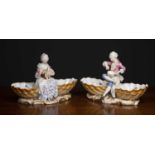 A pair of Meissen porcelain sweetmeat dishes, each with seated courtly figures preparing food,