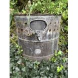 A 'D' shaped copper planter made from an antique hot water heater, with label for Ewart & Son,