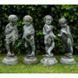 A group of four antique lead allegorical sculptures of children representing the four seasons,