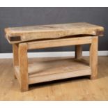 An early 20th century beech and pine rectangular butchers block on a pine stand, 153cm wide x 62cm