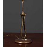 A brass art nouveau table lamp the base 17cm diameter, the lamp standing 44cm high to the