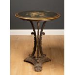 A Victorian circular occasional table with painted slate top and cast iron base with acanthus leaf