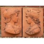 A pair of terracotta coloured cast plaques depicting Renaissance figures in profile, each plaque