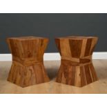 A pair of modern hardwood square topped occasional tables of hourglass form, 35cm wide x 49.5cm high