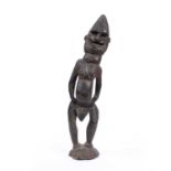 A Papua New Guinea ancestor figure, carved wood figure slightly leaning to one side with incised