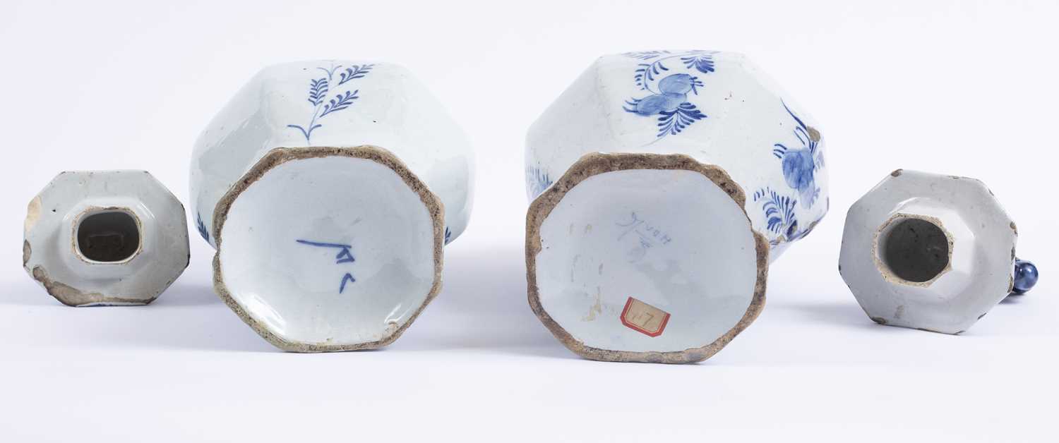 Two late 17th/18th century Delft blue and white pottery vases with covers, each decorated pastoral - Image 3 of 3