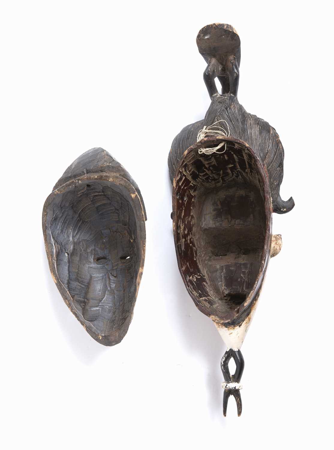 A Baule mask, Ivory Coast, carved wood with high incised coiffure topped by a bird with white and - Image 4 of 4