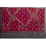 A Pakistan, Sind, finely embroidered wedding shawl fragment with star and florette design on a red