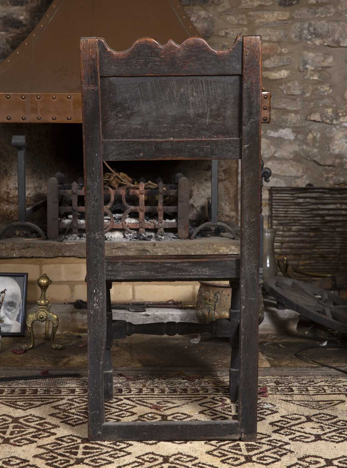 An 18th century oak side chair, the panelled back with shaped top rail, having solid seat, on turned - Image 3 of 3