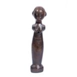 A East African Tanzania wooden doll, carved wood, holes in upper and bottom section for movable arms