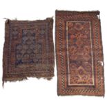 An old Belouch prayer rug with a central pattern of guls on a dark blue ground, 114 x 99cm and