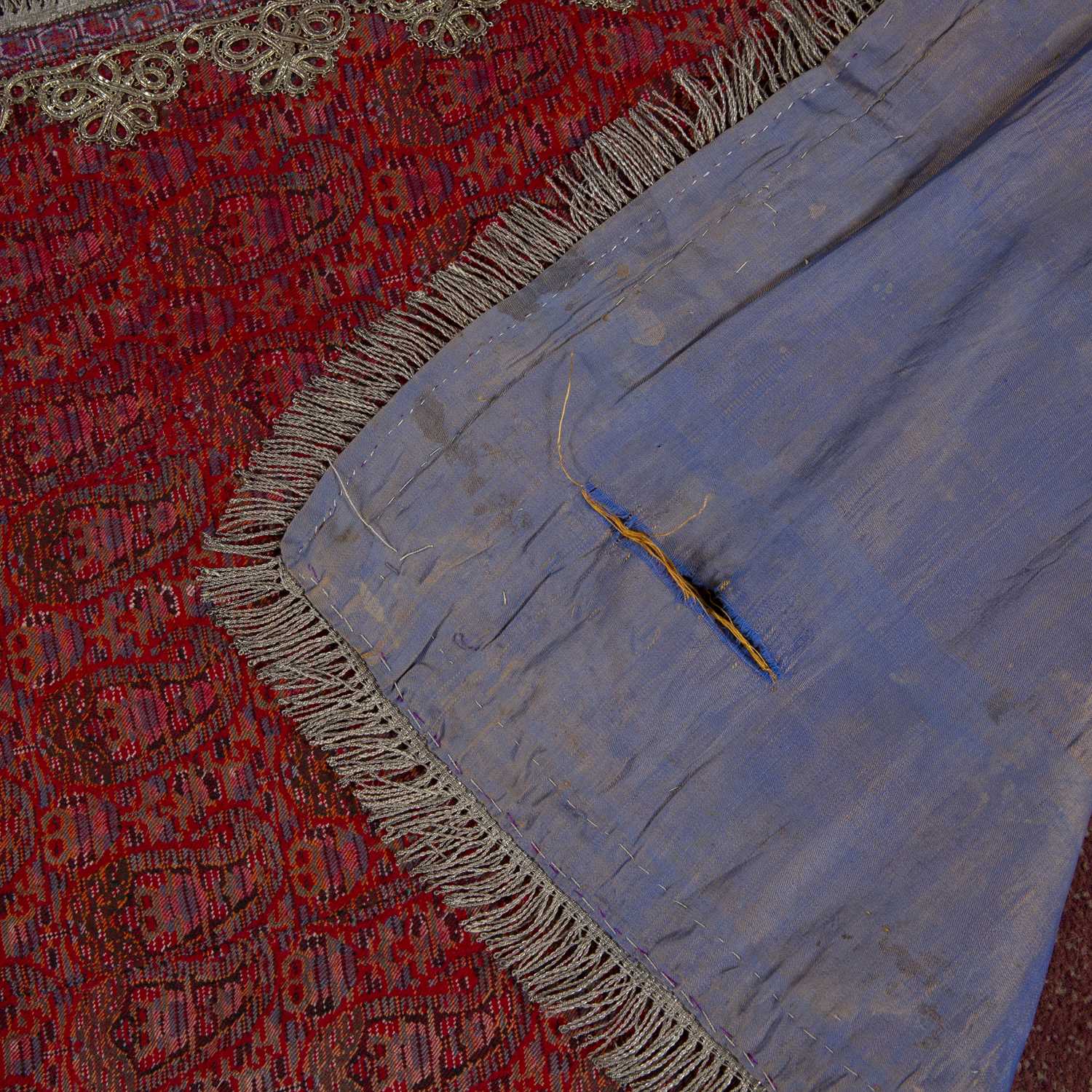 A Persian Kirman Termineh twill for a cradle with repeating boteh motif on a red ground with - Image 2 of 2