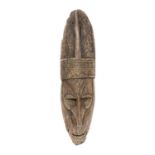 A Papua New Guinea, Sepik river mask, carved wood incised decoration with remnants of red