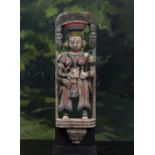 A mid 20th century Gujarat painted wooden figure of a mother and child, mounted on a stand, 50cm