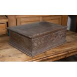 A late 17th century oak bible box, the front with stylised carved decoration, 66cm wide