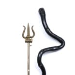 An Indian brass Trisul or trident c.1930 on stand, 52cm long; and an ebonised stick in the form of a