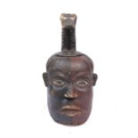 A Congo male head helmet mask, carved wood lacquered in two colours red and black, the head