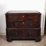An early 19th century French mahogany chest of three long drawers, of canted rectangular outline,