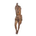 A carved wood Corpus Christi, perhaps Medieval French, of rustic torso form with loin cloth, 110cm
