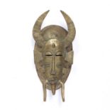 A Senufo brass mask, West African, 32cm long provenance: Tomi van Duuren collection