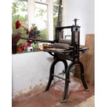 An early 20th century black painted cast iron book printing press, 136cm high; and a similar small