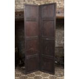 Two sections of antique oak panelling, hinged to form a two fold screen, 194cm high