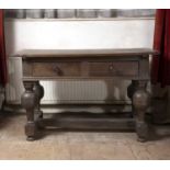 An early 19th century Continental oak side table, with two frieze drawers, on bulbous turned