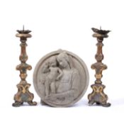 A pair of 19th century continental painted wooden pricket candlesticks of scrolled triangular form