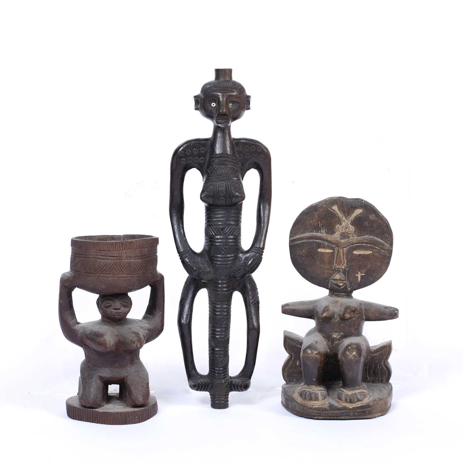 Three African carved wood tribal figures, one Ashanti figure sat on a stool, another figure with