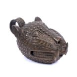 A 20th century Leopard society Benin bronze head ornament, pattern bronze with a circular handle,