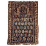 A 19th century Caucasian prayer rug with eight rows of guls on a dark blue ground, 113 x 81cm